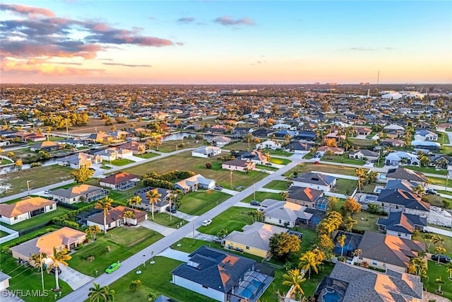 aerial view at dusk with a residential view