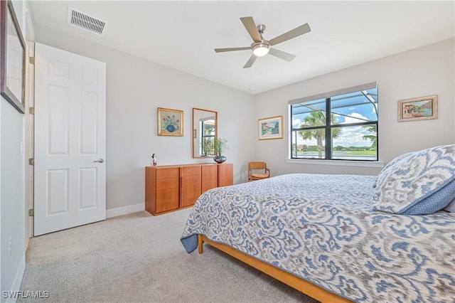 bedroom featuring carpet, visible vents, ceiling fan, and baseboards