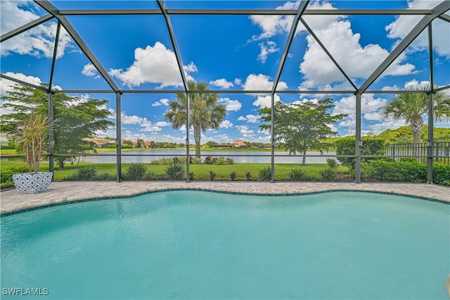 view of swimming pool featuring a water view and a lanai