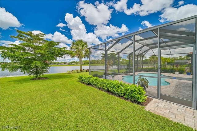 exterior space featuring a water view, a lanai, and a yard