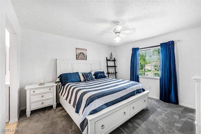 bedroom with carpet floors, ceiling fan, and a textured ceiling