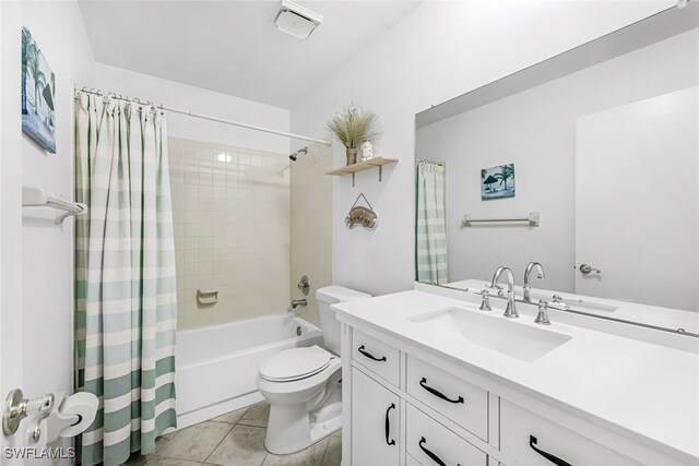 full bathroom featuring shower / tub combo, tile patterned floors, toilet, and vanity