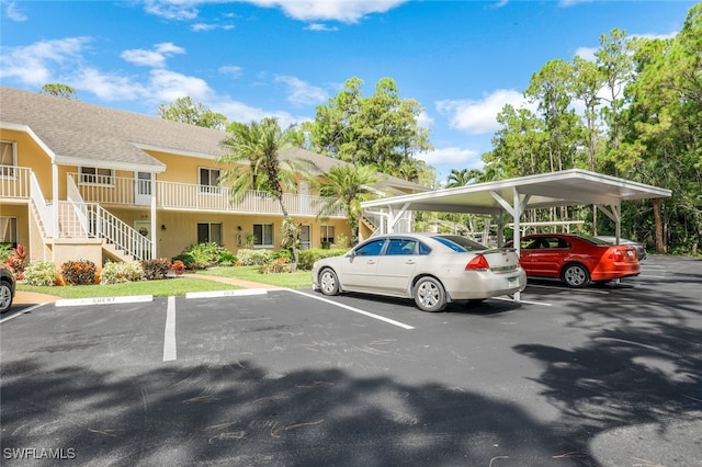 view of vehicle parking featuring a carport