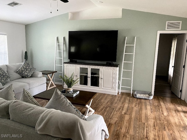 living room featuring hardwood / wood-style floors and ceiling fan