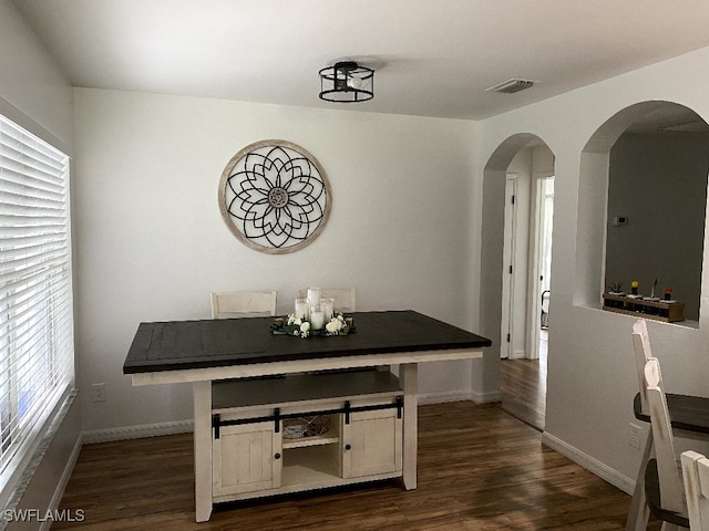 home office with dark wood-type flooring