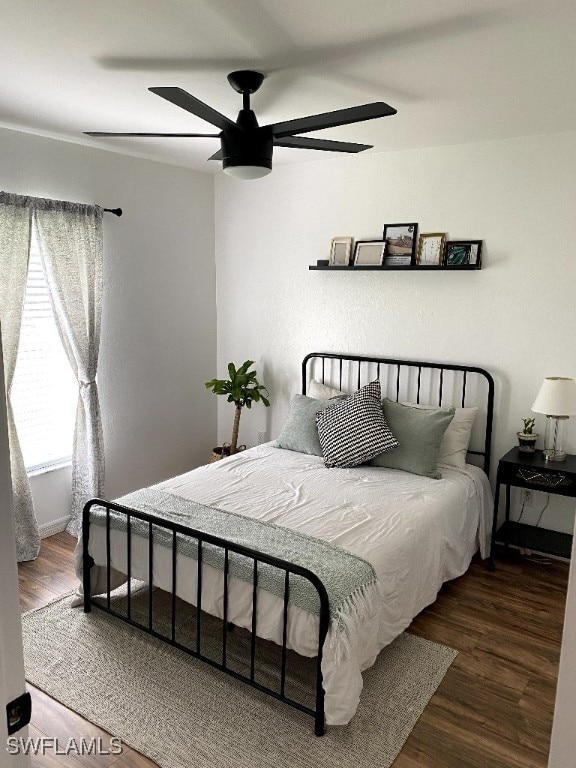 bedroom with ceiling fan and hardwood / wood-style floors