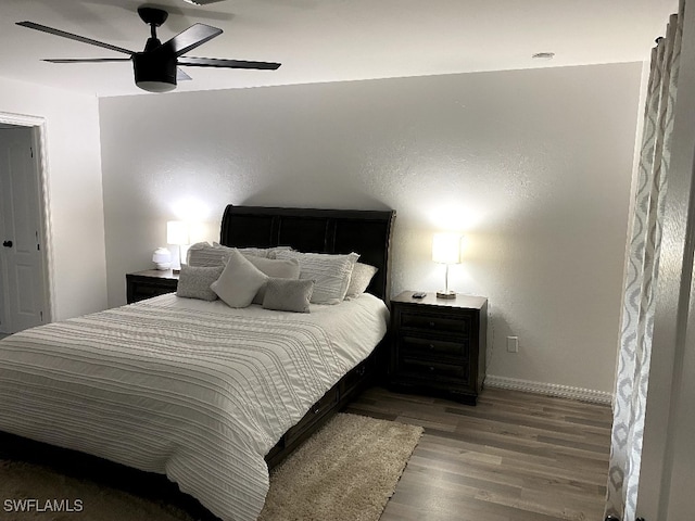 bedroom featuring ceiling fan and wood-type flooring