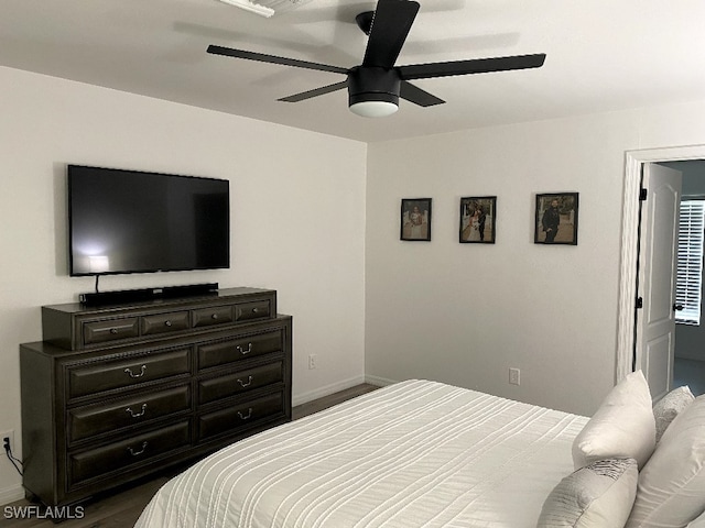 bedroom with ceiling fan and hardwood / wood-style flooring