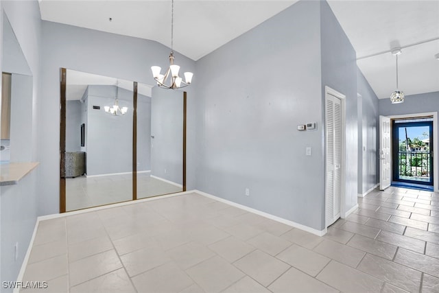 interior space featuring a chandelier and vaulted ceiling