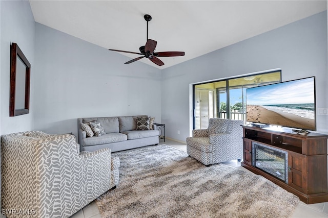 tiled living room with ceiling fan