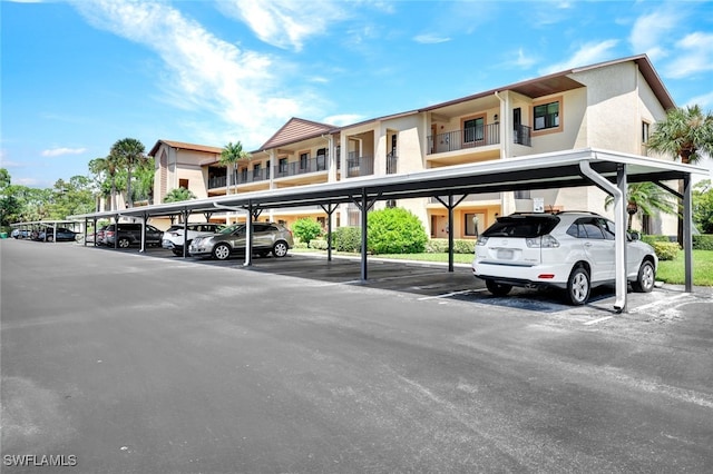 view of parking / parking lot featuring a carport