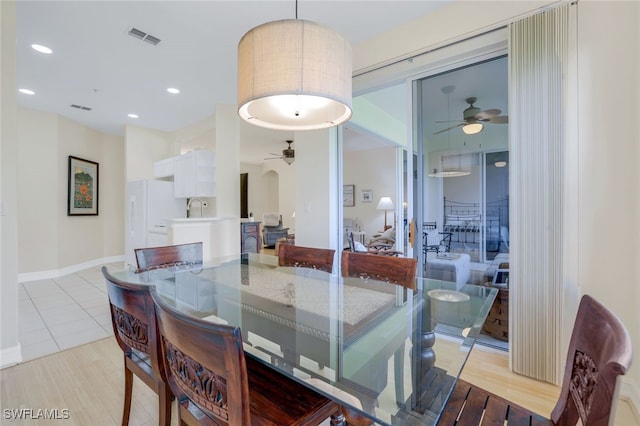 dining room featuring baseboards, visible vents, a ceiling fan, and recessed lighting