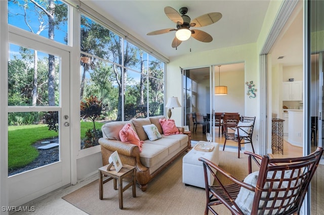 sunroom with a ceiling fan