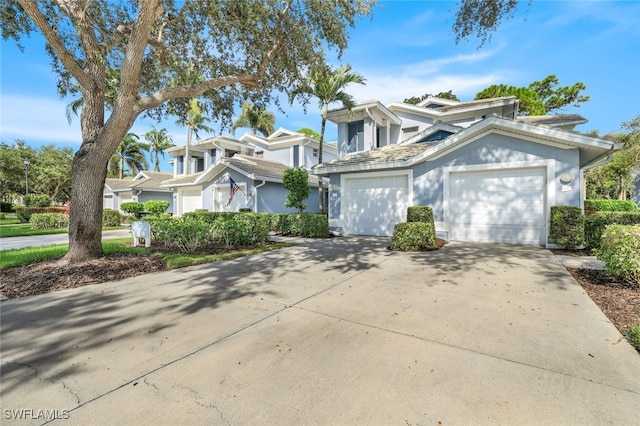 traditional-style home with driveway and an attached garage