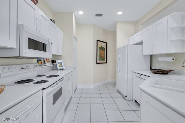 kitchen with white appliances, visible vents, white cabinets, light countertops, and open shelves