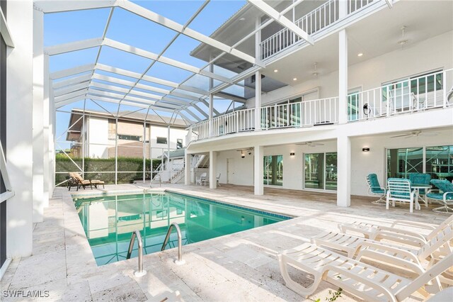 view of pool featuring a patio area and a lanai