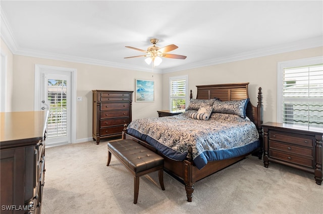 bedroom featuring multiple windows, light carpet, and crown molding