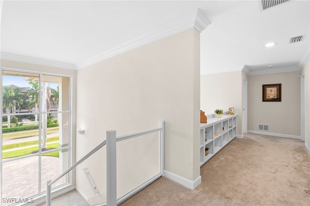 corridor with light colored carpet and crown molding