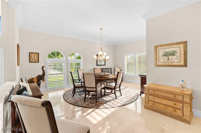 dining room with ornamental molding, a notable chandelier, and light tile patterned floors