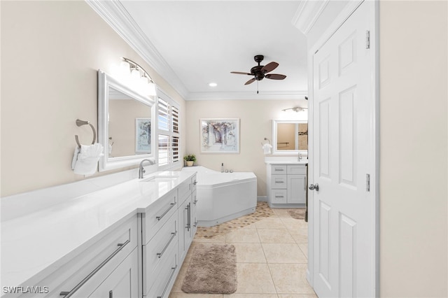 bathroom with ceiling fan, vanity, ornamental molding, tile patterned floors, and a bath