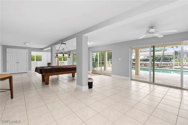 rec room with ceiling fan, billiards, a healthy amount of sunlight, and light tile patterned floors