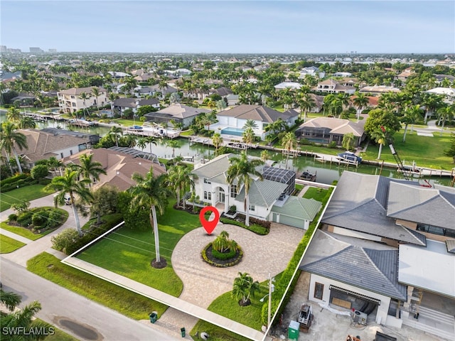 birds eye view of property featuring a water view and a residential view