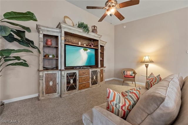 carpeted living area featuring a ceiling fan and baseboards