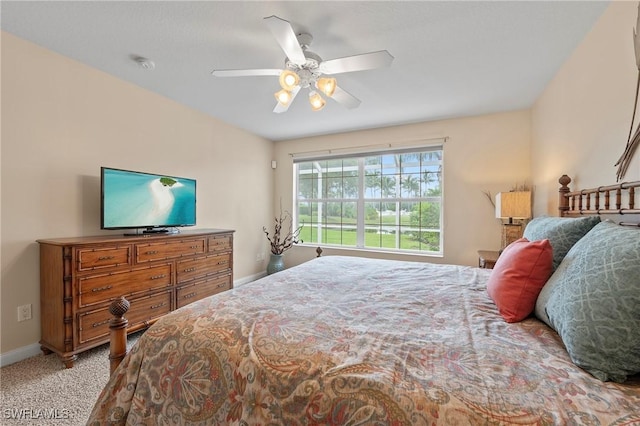 bedroom with carpet floors, ceiling fan, and baseboards