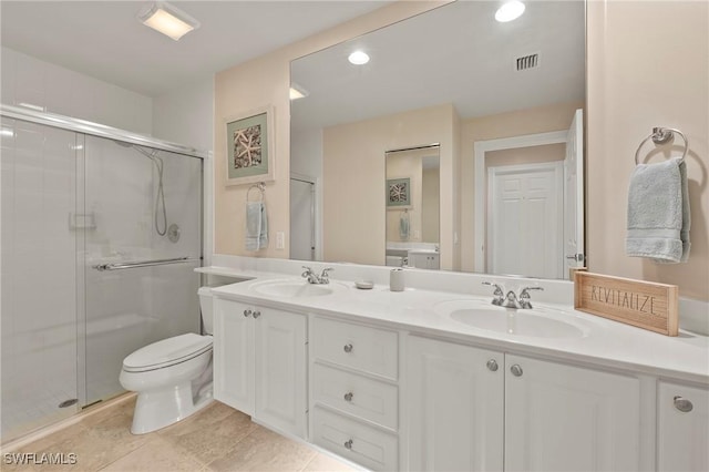 bathroom with a shower stall, visible vents, and a sink