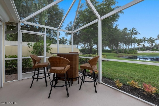 sunroom with a water view