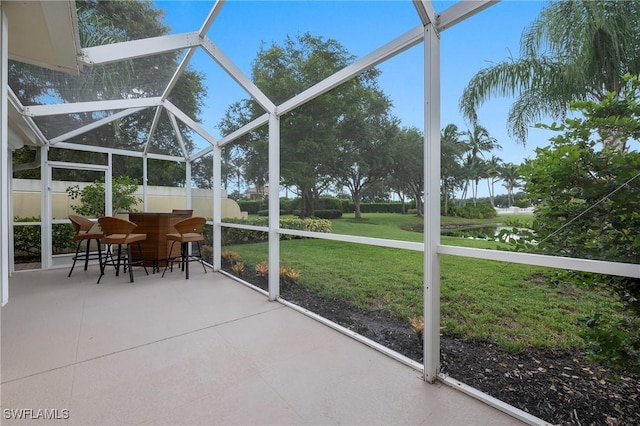 unfurnished sunroom featuring a wealth of natural light