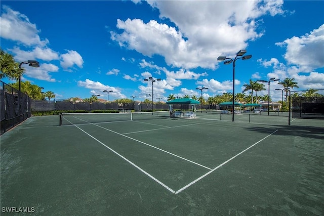 view of sport court featuring fence