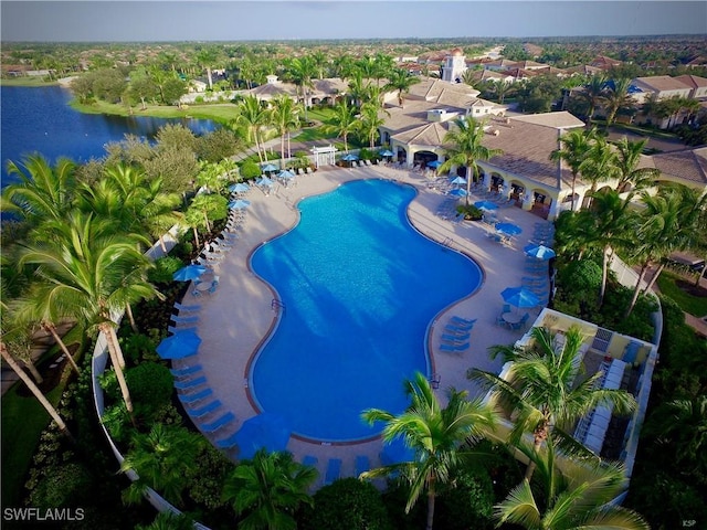 community pool featuring a water view and a patio