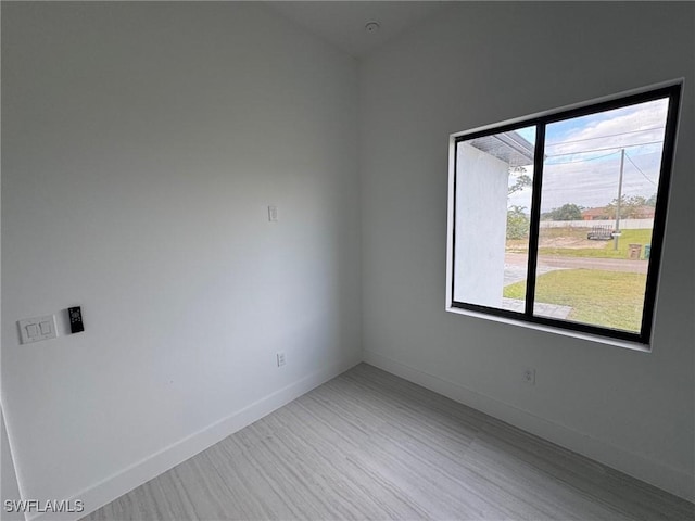 unfurnished room featuring light wood-type flooring