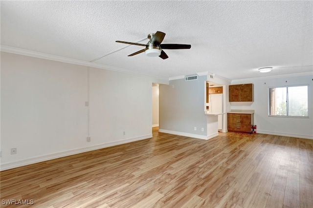 unfurnished living room featuring ceiling fan, light hardwood / wood-style floors, a textured ceiling, and ornamental molding