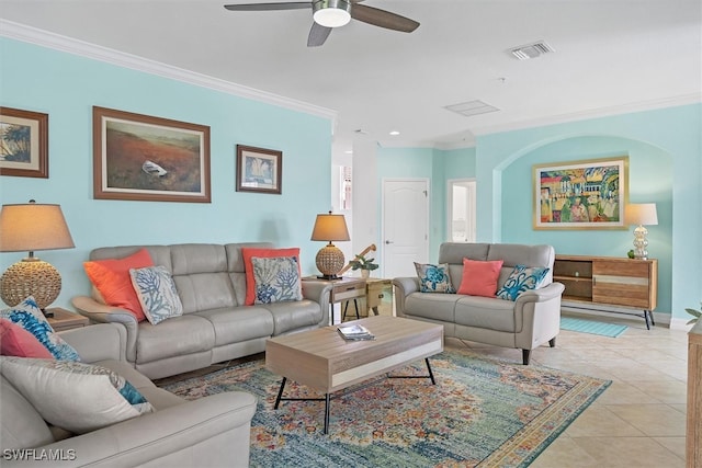 tiled living room with ceiling fan and ornamental molding