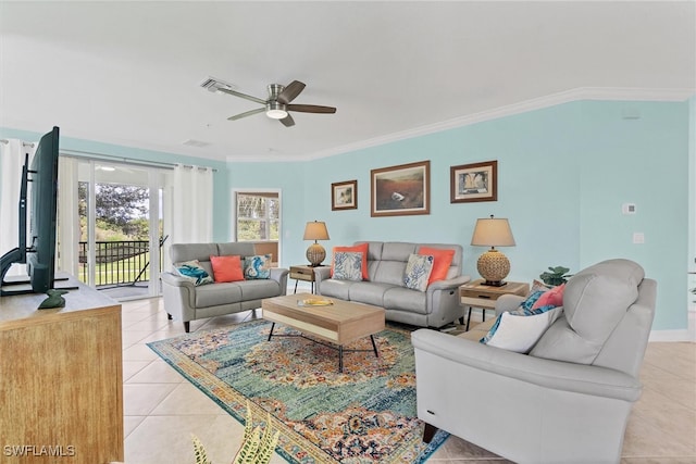 living room featuring ceiling fan, light tile patterned floors, and ornamental molding