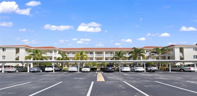 view of parking / parking lot with a carport