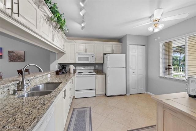 kitchen featuring ceiling fan, light tile patterned floors, sink, rail lighting, and white appliances