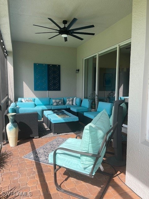 view of patio / terrace with ceiling fan and outdoor lounge area