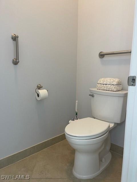 bathroom featuring tile patterned flooring and toilet