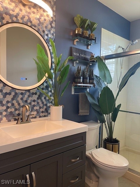 bathroom featuring backsplash, an enclosed shower, toilet, and vanity