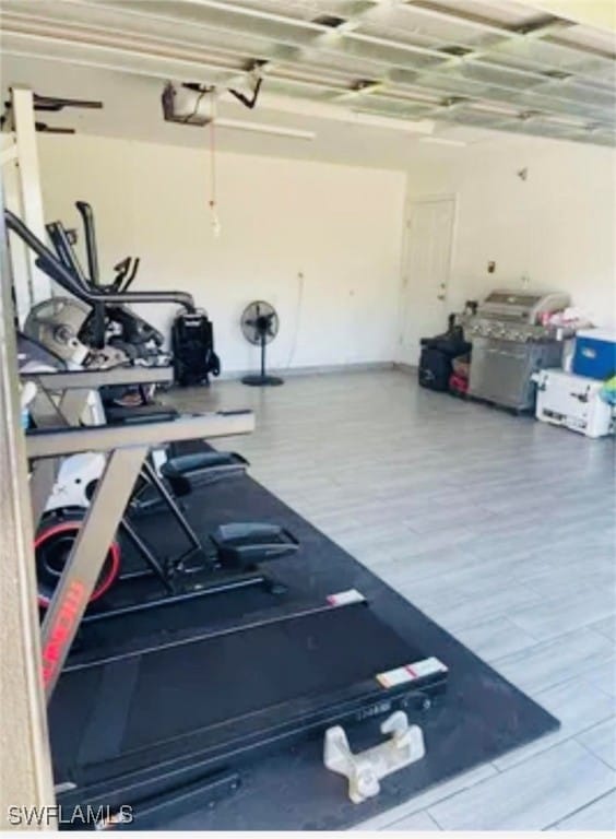 workout area with hardwood / wood-style floors