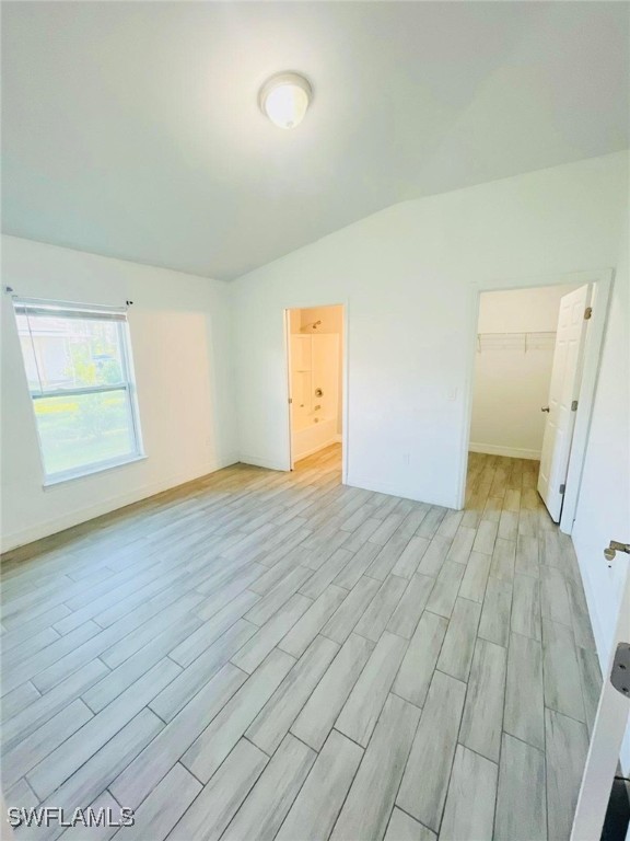 spare room with light wood-type flooring