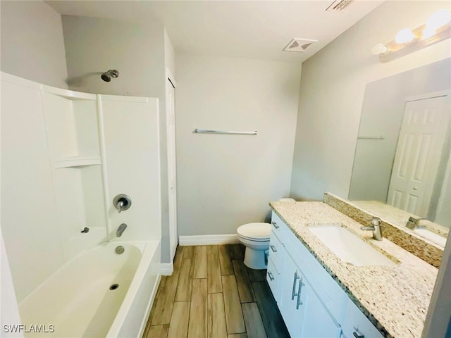 full bathroom featuring bathtub / shower combination, toilet, vanity, and wood-type flooring