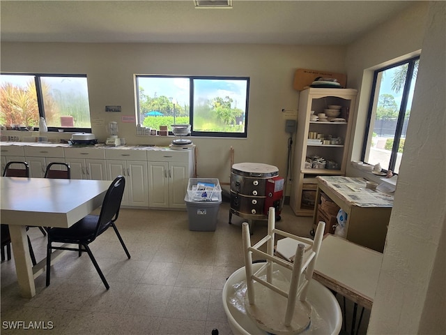 kitchen featuring white cabinets