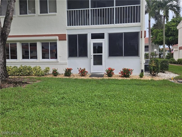 13331 Medinah Cir W Unit 1, Fort Myers, FL 33907 - exterior space with a lawn and stucco siding
