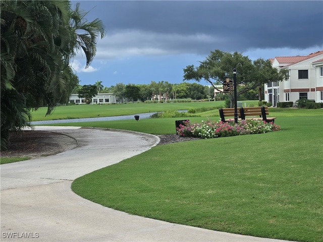 view of property's community featuring a yard