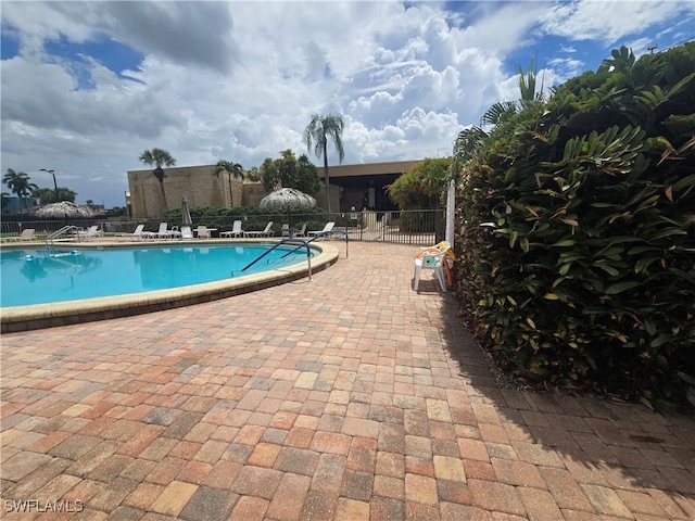 13331 Medinah Cir W Unit 1, Fort Myers, FL 33907 - pool featuring a patio area and fence