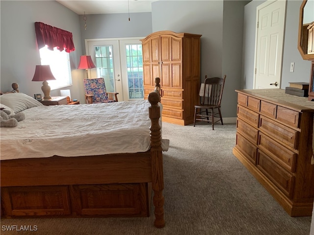 carpeted bedroom with access to exterior